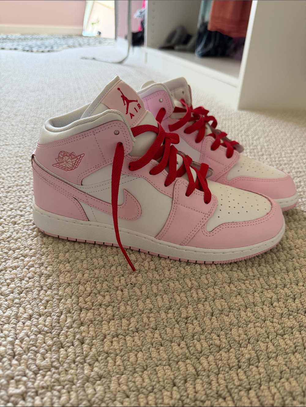 Jordan Pink and White High-Top Sneakers with Red Laces